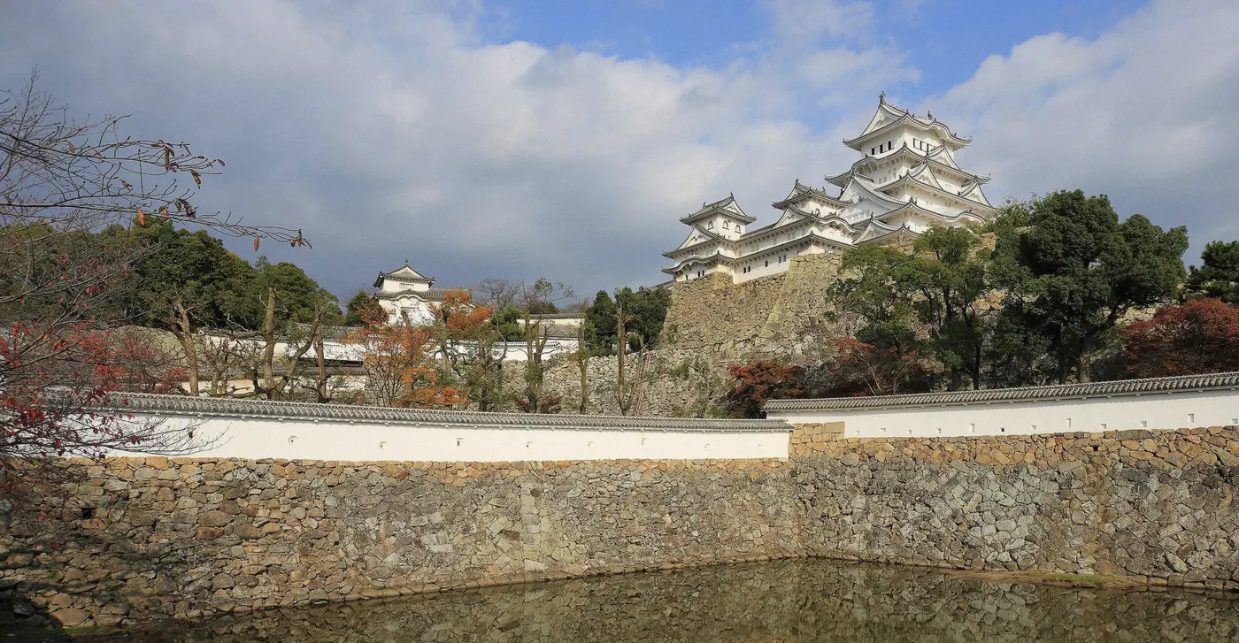 Steep wooden stairs and white walls inside the keep of Himeji Castle on Himeji Castle tickets, Japan