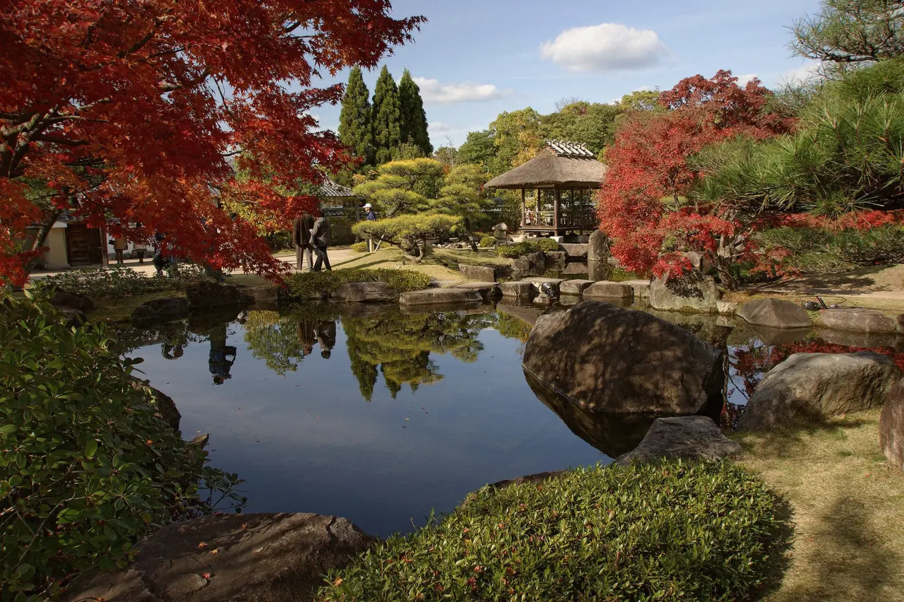 Carp pond and stone lantern in Koko-en Garden near Himeji Castle, Japan