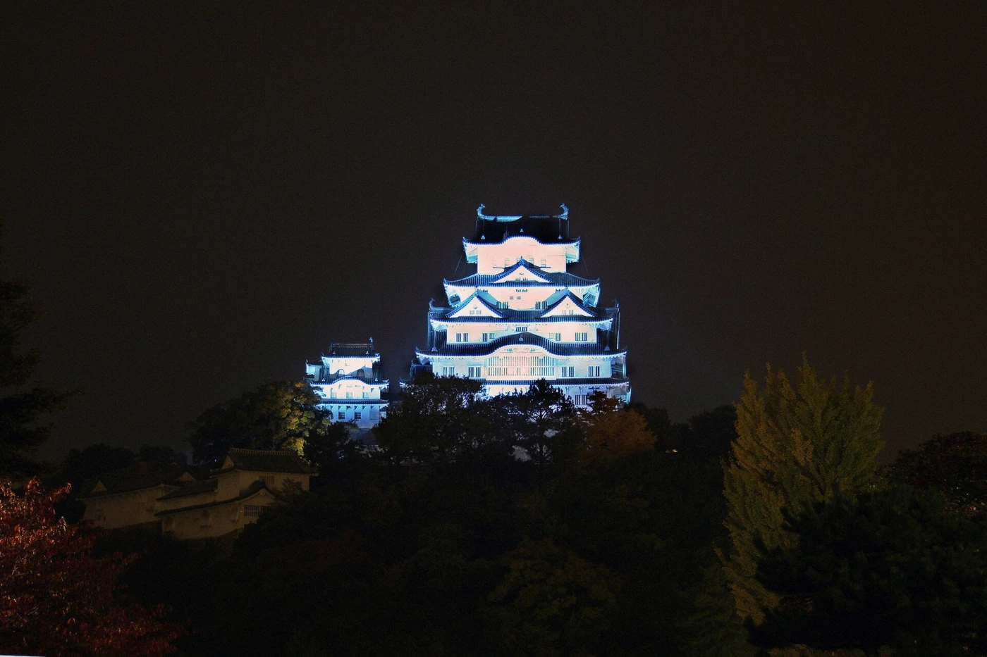 Himeji Castle keep illuminated blue at night in Himeji, Japan