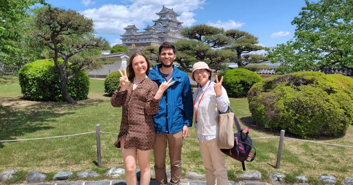 Koko-en Garden's raked paths and Himeji Castle keep behind on the castle and garden guided tour in Himeji, Japan